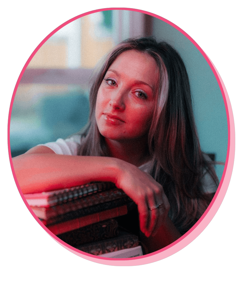 Megan Monty with a stack of books